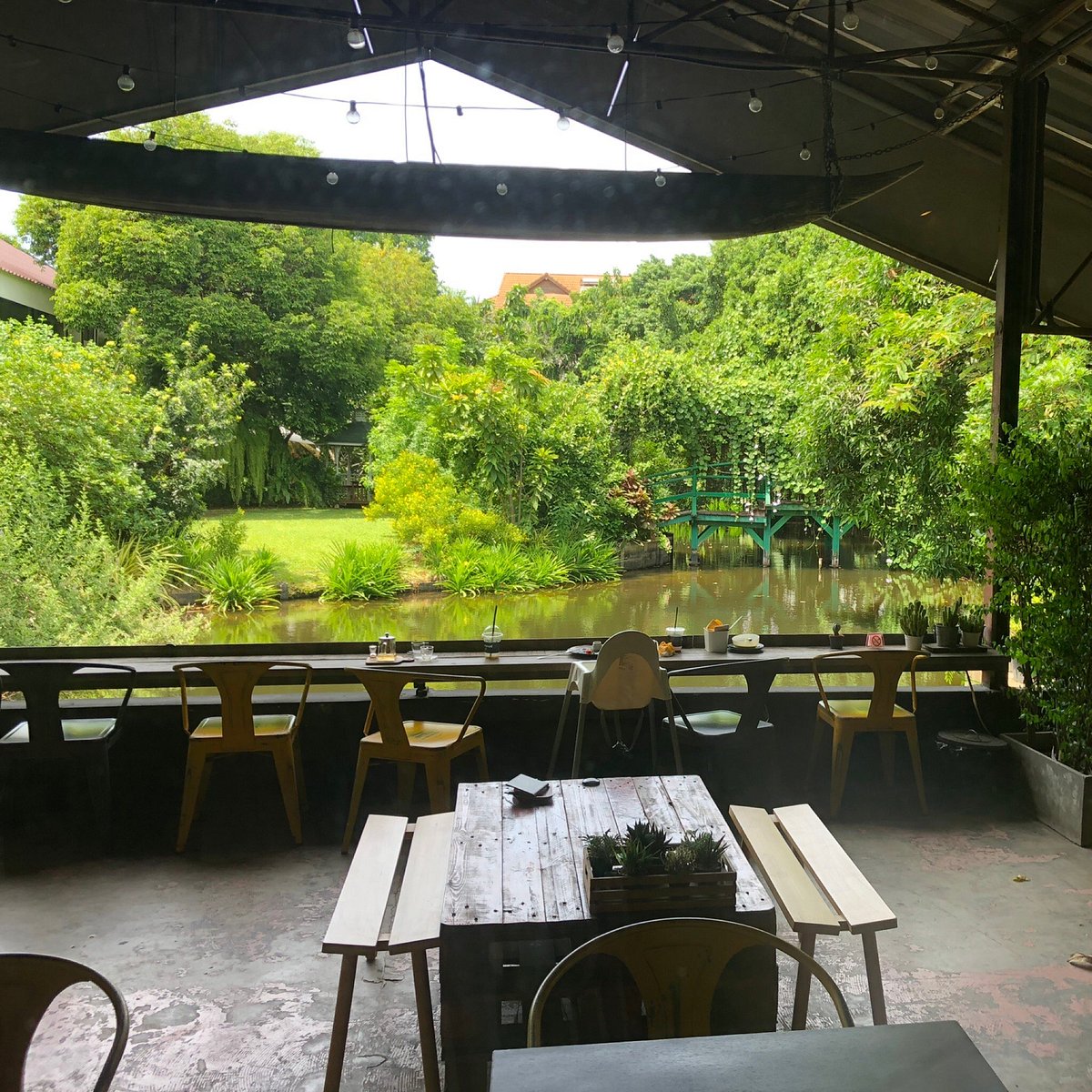 Covered outdoor seating with garden views